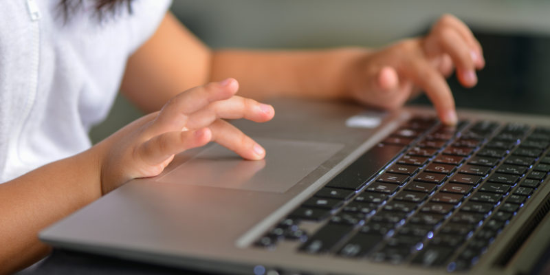 Little hand and keyboard notebook.